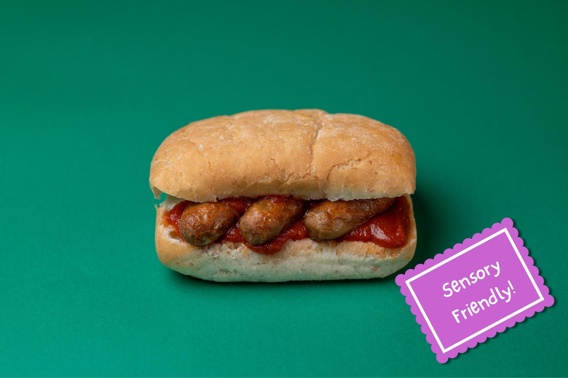 sausages in a roll with tomato sauce